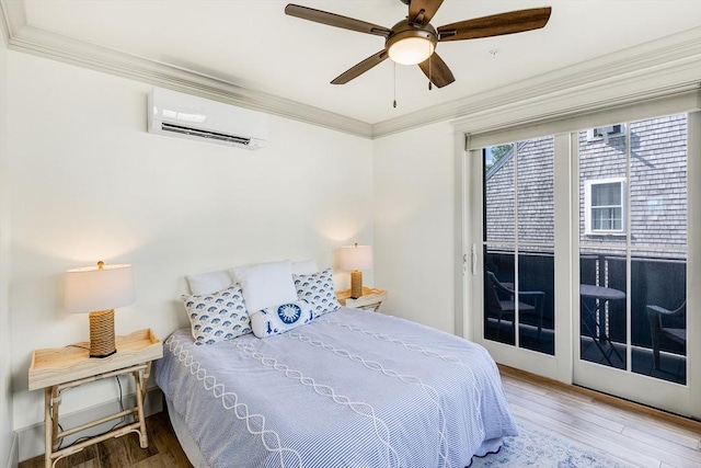 2-6 Market St Unit 2, Newburyport, MA 01950 - bedroom with a wall mounted AC, wood finished floors, crown molding, access to outside, and ceiling fan