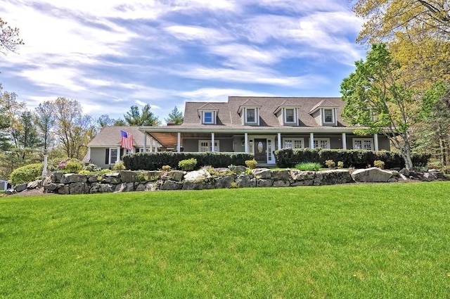 view of front of property featuring a front yard and a porch