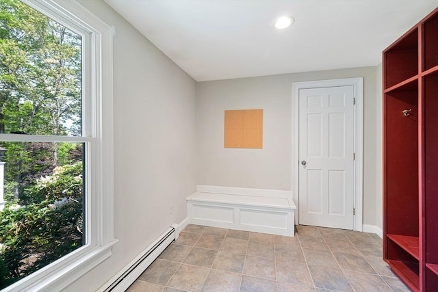 mudroom with a baseboard radiator, recessed lighting, light tile patterned flooring, and baseboards