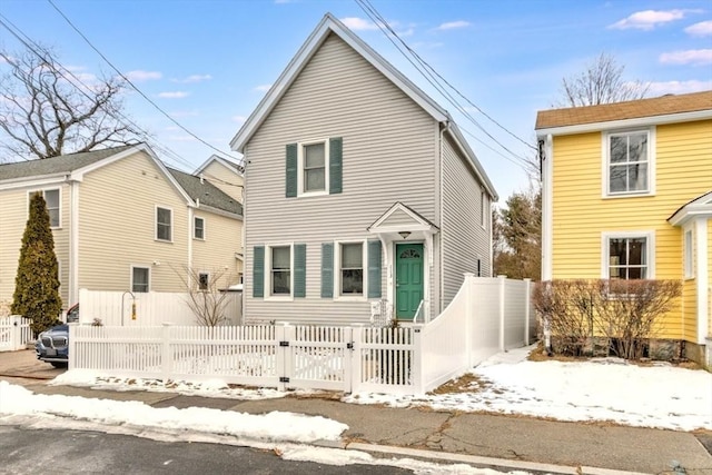 traditional home with a fenced front yard