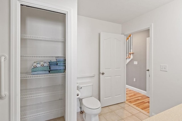 38 Tarbell St Unit 1B, Pepperell, MA 01463 - bathroom featuring tile patterned flooring, toilet, and baseboards