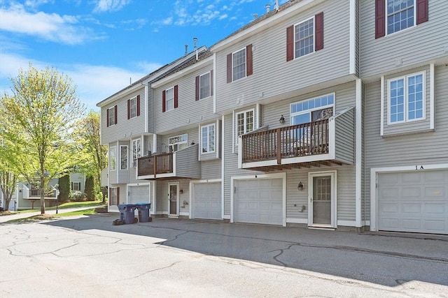 38 Tarbell St Unit 1B, Pepperell, MA 01463 - view of building exterior featuring a garage and a residential view