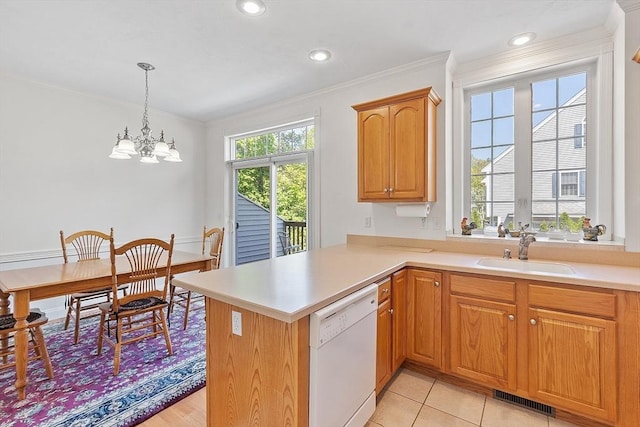38 Tarbell St Unit 1B, Pepperell, MA 01463 - kitchen with white dishwasher, a sink, a chandelier, ornamental molding, and a peninsula