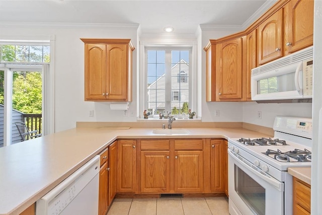 38 Tarbell St Unit 1B, Pepperell, MA 01463 - kitchen with white appliances, a sink, light countertops, ornamental molding, and light tile patterned flooring