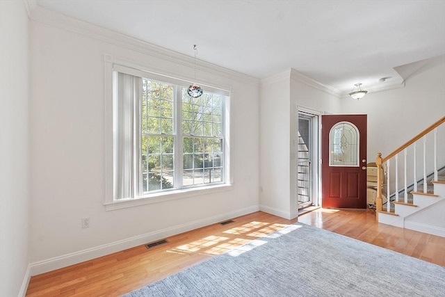 38 Tarbell St Unit 1B, Pepperell, MA 01463 - entryway featuring wood finished floors, crown molding, stairs, and baseboards