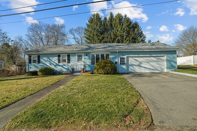 ranch-style home with a front lawn and a garage