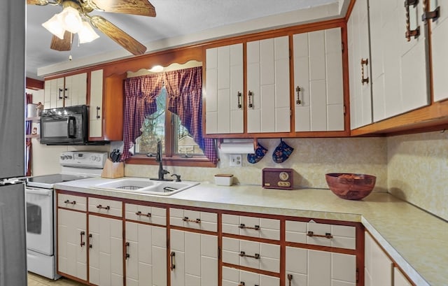 kitchen featuring tasteful backsplash, ceiling fan, sink, white electric stove, and white cabinetry