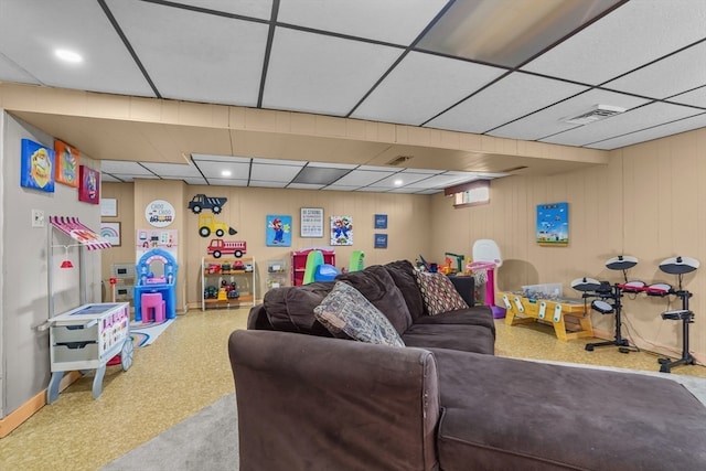 living room with a paneled ceiling