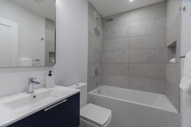 full bathroom featuring vanity, toilet, and tiled shower / bath