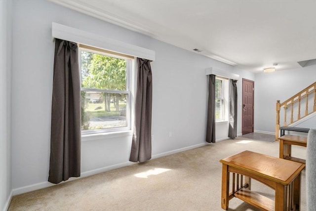 70 Granby Hts Unit 70, Granby, MA 01033 - living room with light carpet, plenty of natural light, and stairway