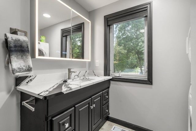 70 Granby Hts Unit 70, Granby, MA 01033 - bathroom with washer / clothes dryer and vanity