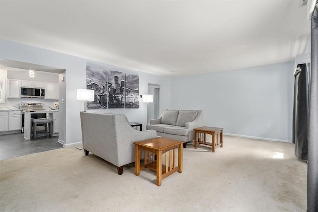 70 Granby Hts Unit 70, Granby, MA 01033 - living room featuring baseboards and light carpet