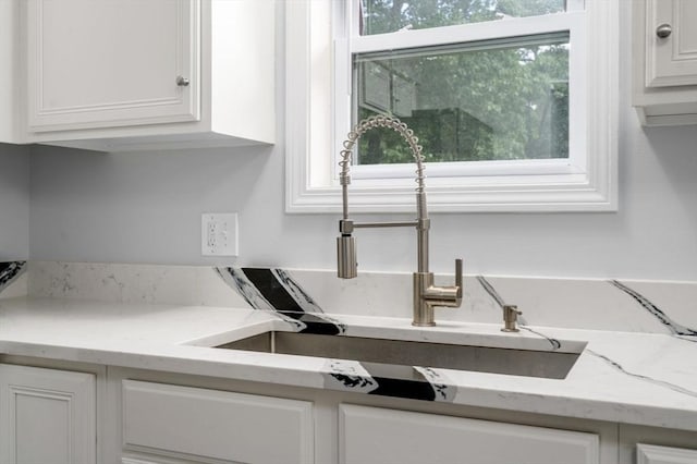 70 Granby Hts Unit 70, Granby, MA 01033 - kitchen view of white cabinetry and light stone countertops