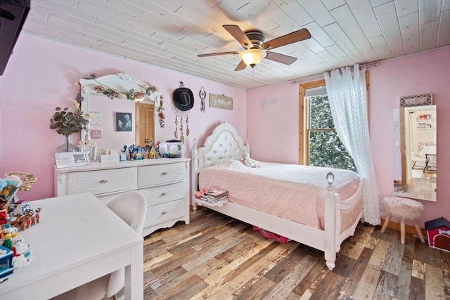 bedroom with ceiling fan, wood ceiling, and hardwood / wood-style floors