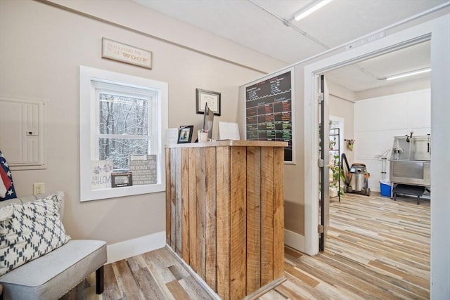 interior space with hardwood / wood-style floors and electric panel