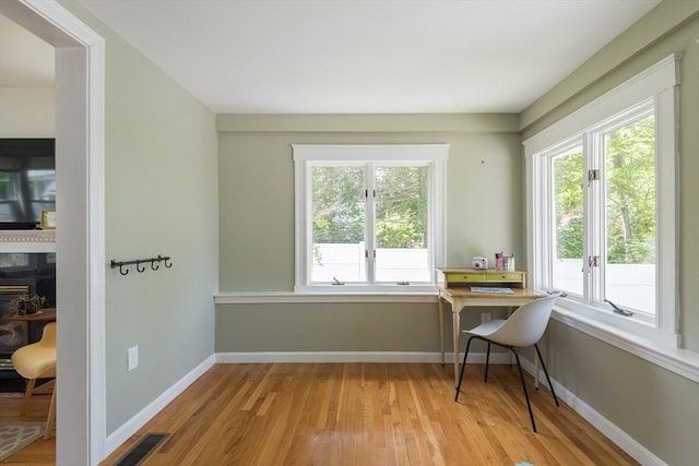 dining area featuring wood finished floors and baseboards