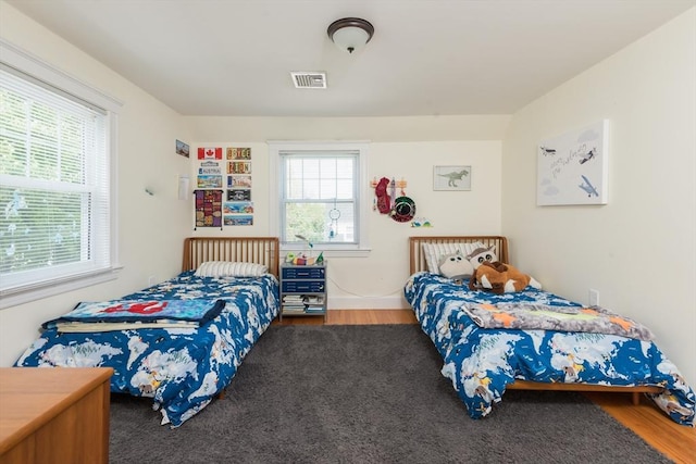 bedroom with wood finished floors