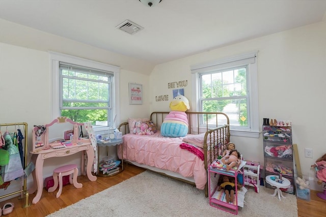bedroom featuring wood finished floors