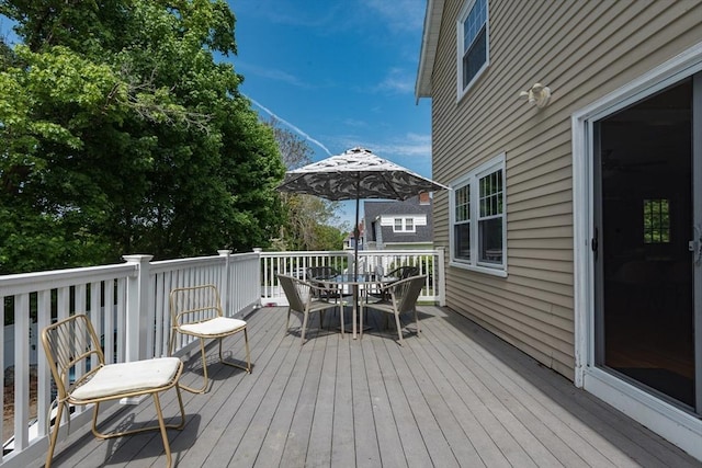 deck with outdoor dining area