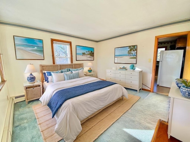 carpeted bedroom featuring white refrigerator, crown molding, and baseboard heating