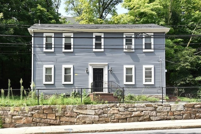 13 Main St, Framingham, MA 01702 - colonial-style house featuring a fenced front yard