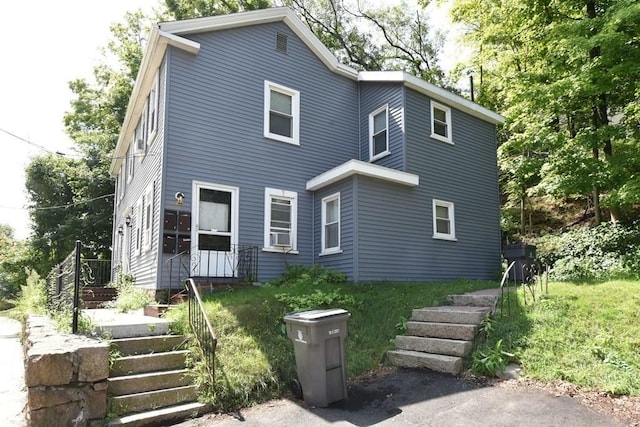 13 Main St, Framingham, MA 01702 - view of front of house with stairway and cooling unit