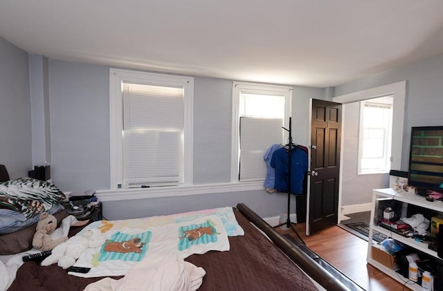 13 Main St, Framingham, MA 01702 - bedroom featuring wood finished floors and multiple windows