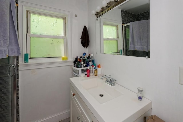13 Main St, Framingham, MA 01702 - bathroom with plenty of natural light, a stall shower, and vanity