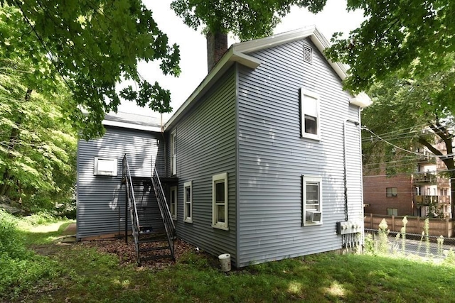 13 Main St, Framingham, MA 01702 - rear view of property with a chimney, stairs, and cooling unit