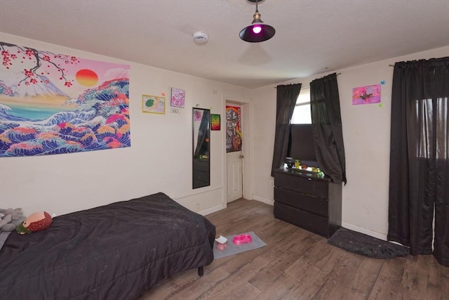 13 Main St, Framingham, MA 01702 - bedroom featuring wood finished floors and baseboards