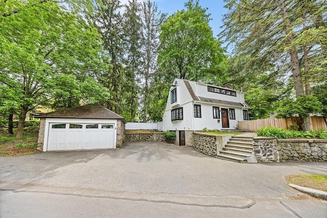 11 N Hancock St, Lexington, MA 02420 - view of front facade with an outbuilding and a detached garage