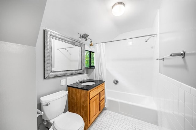 11 N Hancock St, Lexington, MA 02420 - full bathroom with vaulted ceiling, toilet, shower / bath combo with shower curtain, and vanity
