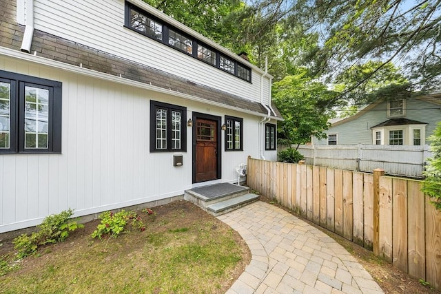 11 N Hancock St, Lexington, MA 02420 - doorway to property with a shingled roof
