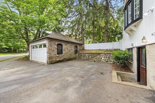 11 N Hancock St, Lexington, MA 02420 - view of patio featuring an outdoor structure and a garage