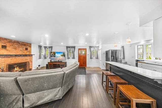 11 N Hancock St, Lexington, MA 02420 - living room featuring recessed lighting, dark wood-style flooring, and a fireplace