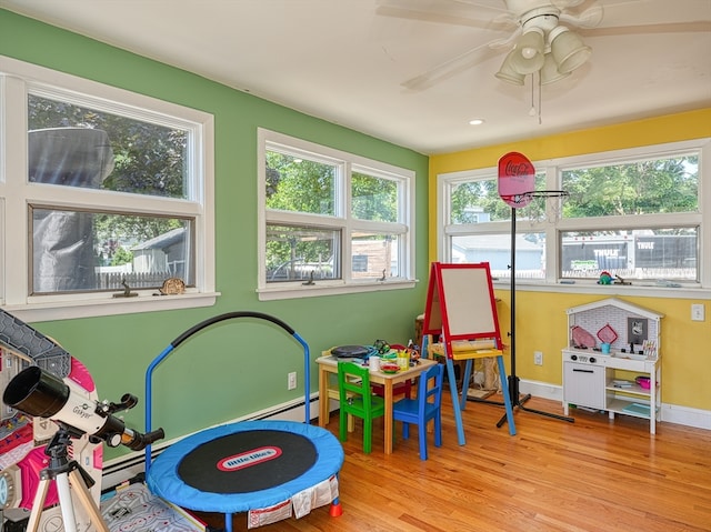 playroom featuring ceiling fan and light wood-type flooring