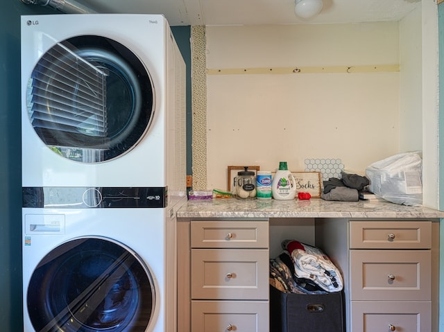 laundry area with stacked washer / dryer