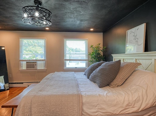 19 Mohawk Rd, Burlington, MA 01803 - bedroom with a baseboard heating unit, wood finished floors, recessed lighting, cooling unit, and baseboards