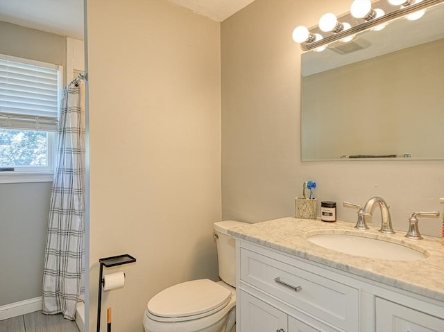 19 Mohawk Rd, Burlington, MA 01803 - bathroom featuring curtained shower, vanity, toilet, and baseboards