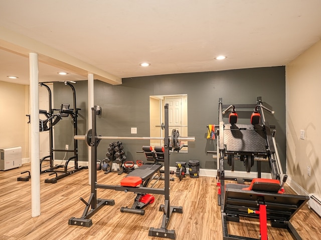 workout room with hardwood / wood-style floors