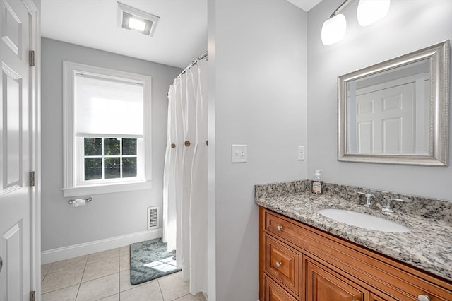 bathroom with vanity and tile patterned flooring