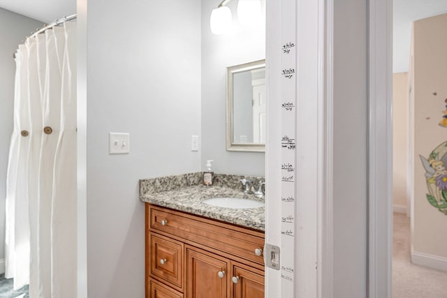 bathroom with a shower with shower curtain and vanity