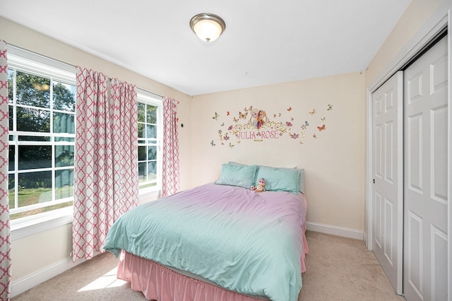 carpeted bedroom featuring a closet