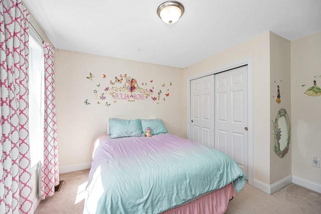 carpeted bedroom with a closet