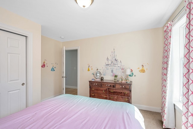 carpeted bedroom with a closet