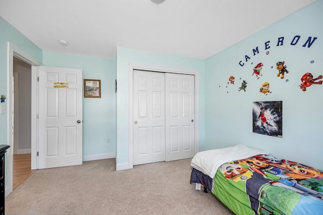 carpeted bedroom with a closet