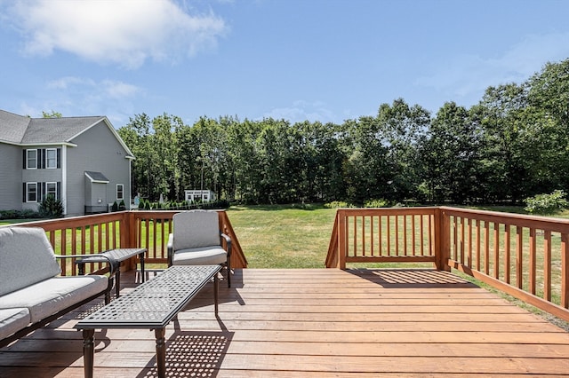 wooden terrace featuring a yard