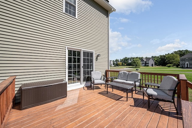 deck featuring a lawn and an outdoor hangout area