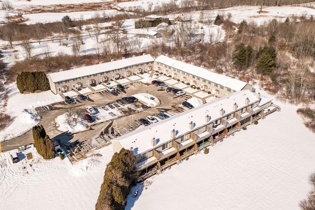 snowy aerial view featuring a water view