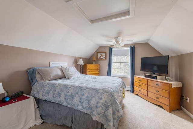 bedroom with light carpet, attic access, baseboards, lofted ceiling, and ceiling fan